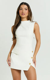 Langley Mini Dress Sleeveless High Neck Faux Wrap Tulip Dress in Cream